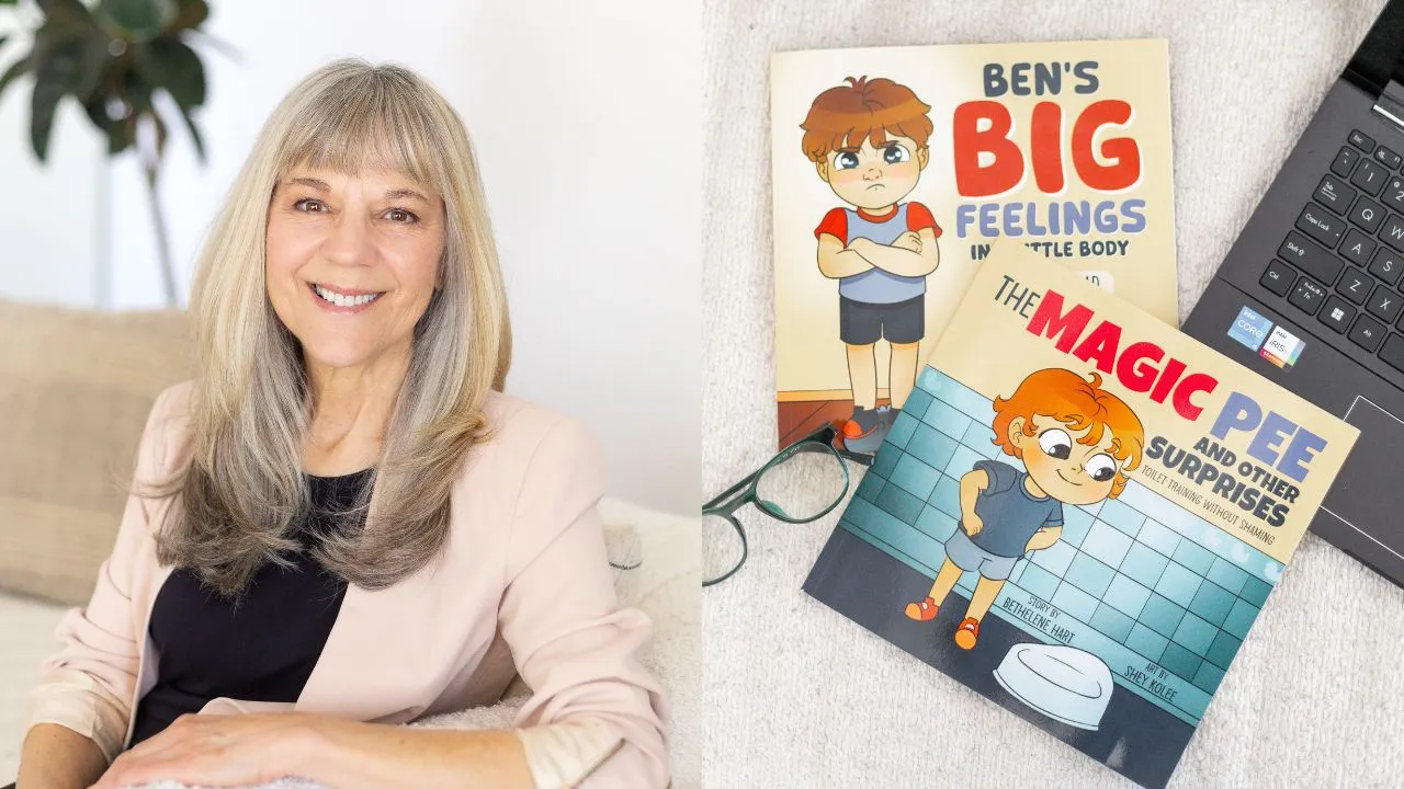 A woman with long blonde hair smiles while seated on a beige couch. Next to her, two colorful children's books are displayed beside a pair of glasses and a laptop.