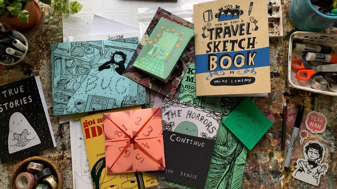 A wooden table featuring a collection of books alongside various decorative objects and writing materials.